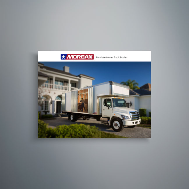 Morgan furniture mover truck body with open cargo area at residential home